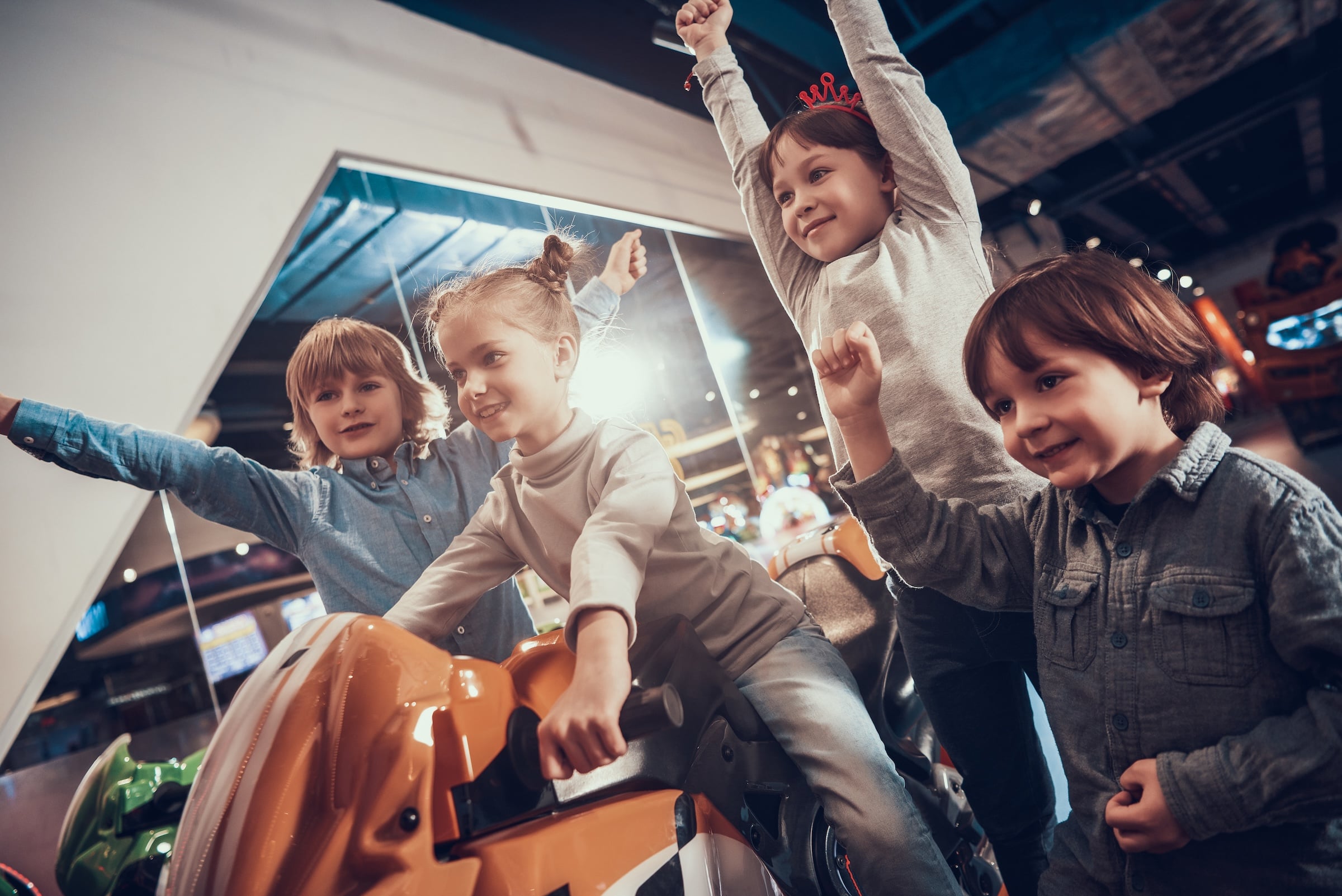 children-playing-racing-game-amusement-center (2) (1) (1)