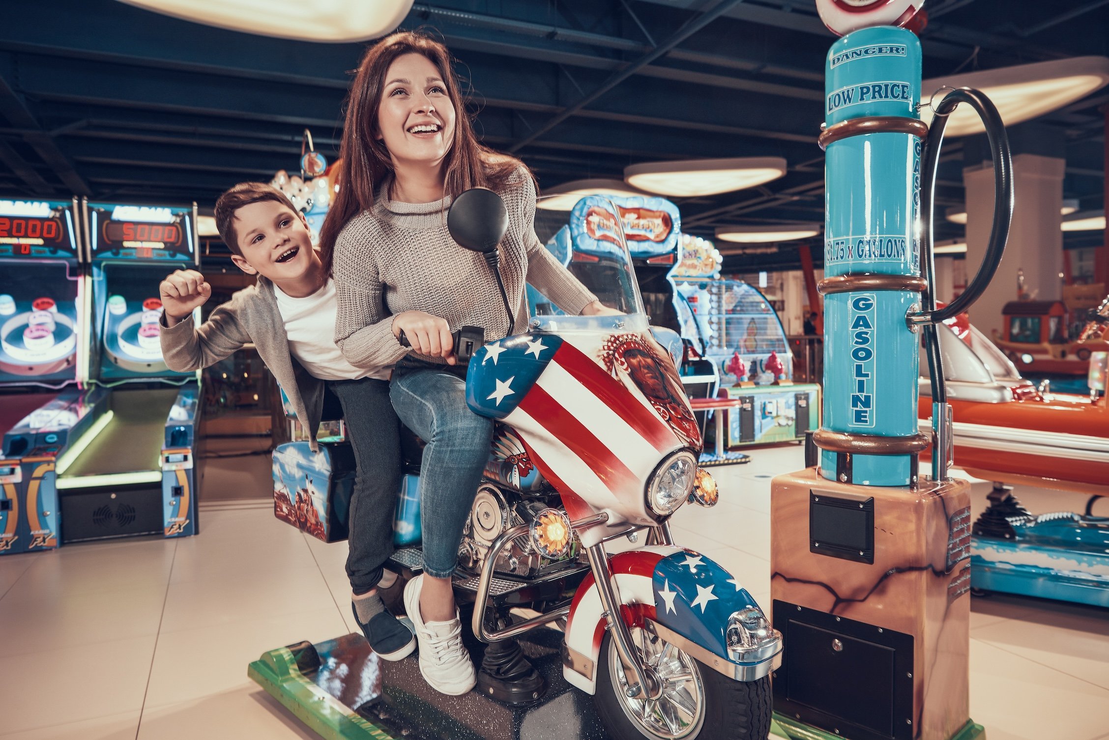 happy-mom-son-toy-motorcycle 